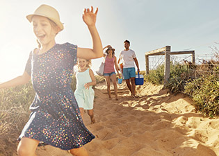 Family walking down to the beach
